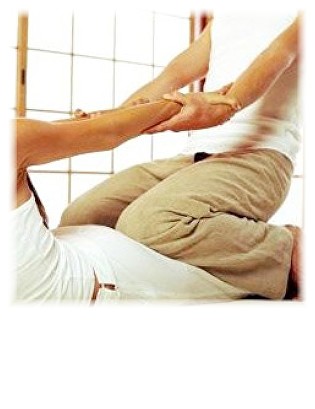A Thai massage stretch performed on a mat, client clothed